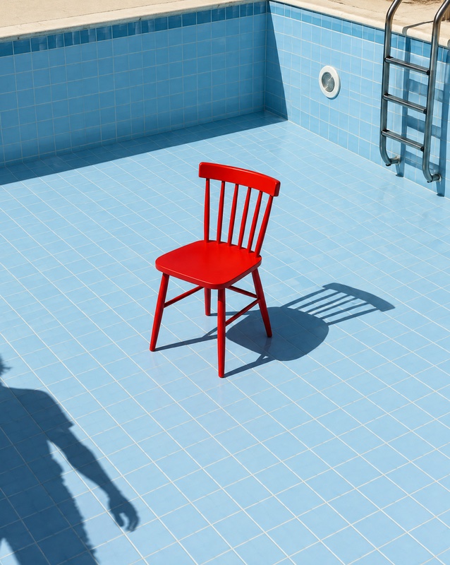 One red chair in an empty pool., made with GPT Image 2.5 Flare
