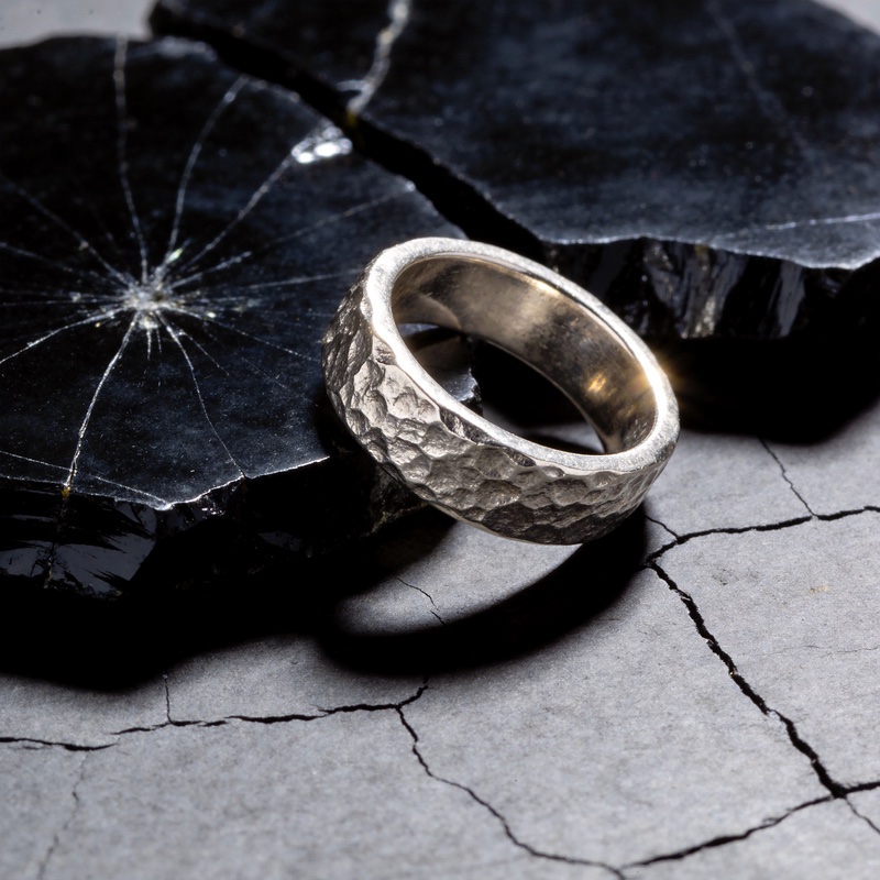A hammered ring on obsidian., made with Seedream 4.5